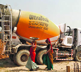 Workers at the construction site of a commercial complex outside Ahmedabad. UltraTech Cement, India's biggest cement producer, on Monday posted a 16.3% year-on-year fall in profit for the quarter ended March.