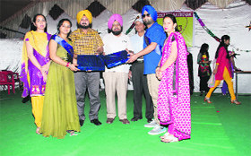 Students of Malwa College being presented mementoes at the farewell party.