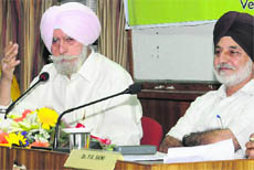 KPS Gill, former Director General of Police, Punjab, and Prof Sucha Singh Gill (right), director general, CRRID, at a training workshop in Panjab University, Chandigarh, on Monday.