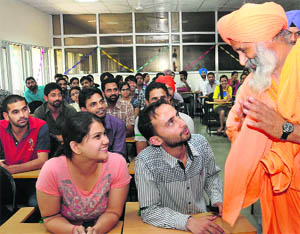 Sant Balbir Singh Seechewal interacts with students at Panjab University in Chandigarh on Monday. 