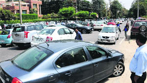 Vehicles parked haphazardly outside a school in Sector 26, Chandigarh. 