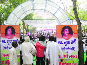 A view of the function to mark the mega health camp held in memory of Sudha Rani (pictures on the gate) at Faridpur in Hisar. 