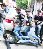 Activists of the ABVP try to stop Vice-Chancellor ADN Bajpais car at HPU in Shimla on Monday. Photo: Amit Kanwar