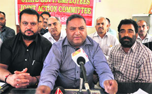 Office-bearers of the State Government Employees Joint Action Committee address media in Jammu on Monday. 