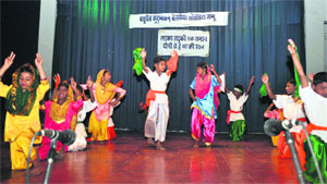 Schoolchildren perform during the silver jubilee cultural function of NGO Vasundhaiva Kutumbakam Welfare society in Jammu on Monday. 