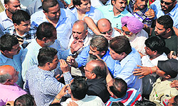 Residents argue with MC officials in the Haibowal Kalan area, Ludhiana, on Monday