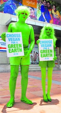 Activists of People for the Ethical Treatment of Animals urge people to go vegetarian on the occasion of World Earth Day, in Hyderabad on Monday