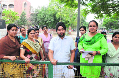 Members of the Special Trainer Teachers Union outside the District Administrative Complex after meeting the Deputy Commissioner in Bathinda in connection with their demands on Tuesday. 
