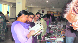 Students browse through books at the GKU fair on Tuesday.
