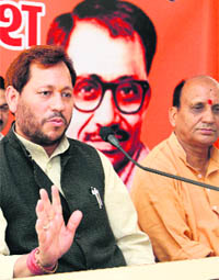 Chief of the state unit of the BJP Teerath Singh Rawat addresses a press conference in Dehradun on Tuesday. 
