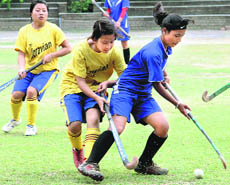 Players in action during a match in the 3rd Welham Girls Invitational Hockey Tournament in Dehradun on Tuesday.
