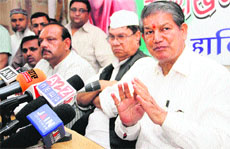 Union Water Resources Minister Harish Rawat addressing a press conference in Dehradun on Tuesday.