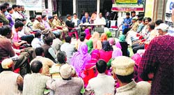 Forest officials attend a gram sabha meeting at Holi tribal township.