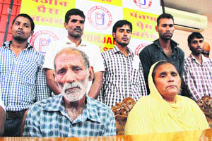 Parents of Jagdeep who has been left stranded in Iraq in a pensive mood in Jalandhar on Tuesday.  