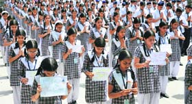 Prayers: Students of Shiksha Niketan Higher Secondary School in Jammu pray for speedy recovery of the five-year-old girl who was brutally raped in Delhi