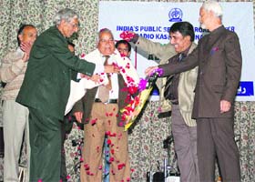 Abdul Ahad Farhad, veteran broadcaster and renowned poet, being felicitated by Radio Kashmir at a function in Srinagar on Tuesday