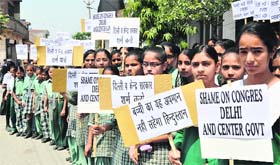 SEEKING JUSTICE FOR THE ANGEL: School students, under the banner of the Matra Shakti Bachao Association, hold a protest against the rape of a five-year-old girl in Delhi, in Ludhiana on Tuesday
