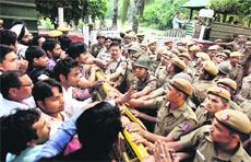 The police stops activists outside Delhi CM Sheila Dikshits residence during a protest against the rape of a minor girl in New Delhi on Tuesday.