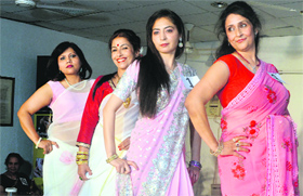 Women strike a pose at the fashion show