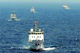 Chinese surveillance ships sail in waters claimed by Japan near the disputed islands called Senkaku in Japan and Diaoyu in China in the East China Sea on Tuesday.