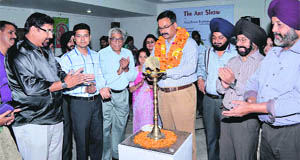 Rajesh Raina inaugurates an art exhibition at KT Kala Art Gallery in Amritsar on Wednesday .