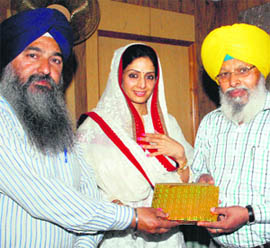Information officers of the Shiromani Gurdwara Parbandhak Committee honour film star Sri Devi at the Golden Temple in Amritsar on Wednesday.