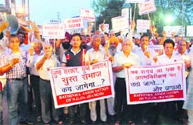 Highlighting the wrong: Members of various non-governmental organisations (NGOs) carried out a candle light procession in protest against the rape of a five-year-old Delhi girl, in Bathinda on Wednesday