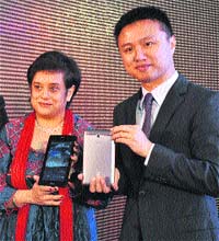 Peter Chang (R), regional head (South Asia), and Debjani Ghosh, MD, Intel, pose with 7-inch ASUS Fonepad during its launch in Delhi on Wednesday. It is priced at Rs 15,999.