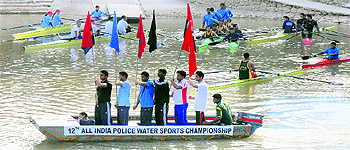 Players participate in the inauguration ceremony of the 12th All India Police Water Sports Championship at Sukhna Lake in Chandigarh on Wednesday