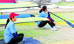 Women players watch the inauguration ceremony