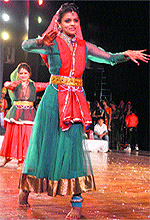 A girl performs during a programme on Mahavira Jayanti in Jammu on Wednesday