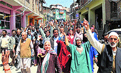 Sarpanches and panches protest against beating of a sarpanch inside a police station by ruling party workers in South Kashmir on Wednesday