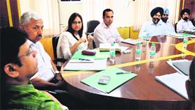 Officials hold a meeting at the Zone D office of the MC in Ludhiana on Wednesday