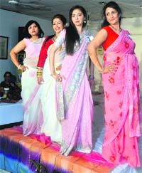 Women strike a pose at the fashion show