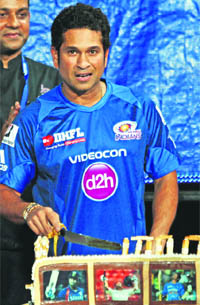 Sachin Tendulkar cuts a cake to celebrate his 40th birthday at Eden Garden in Kolkata ahead of a match against Kolkata Knight Riders on Wednesday. 