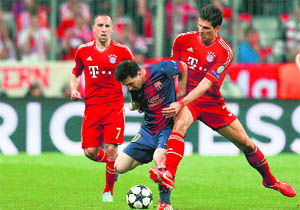 Bayern's Mario Gomez, right, who scored the controversial second goal, tackles Messi. 