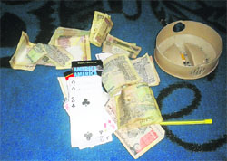 playing cards and cash recoverd from them in Amritsar. 