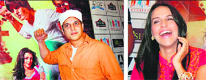 Bollywood actors Jimmy Shergill and Neha Dhupia (right) promote their upcoming film Rangeelay" in Amritsar on Thursday. 