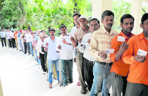 Voters queue up outside the Railway Institute on Thandi Sarak to cast their votes for the railway union elections in Bathinda on Thursday. 