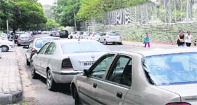 Cars parked Haphazardly on the road outside DAV College in Sector 10