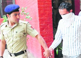 The accused being taken to a court in Chandigarh on Thursday