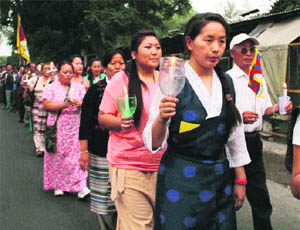 Tibetans hold a candlelight march against the abduction and illegal detention of the 11th Penchen Lama in Dehradun on Thursday.