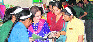 Students participate in a book fair held at The Indian Cambridge School in Dehradun on Thursday. 