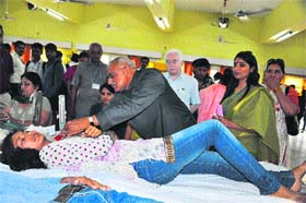 HS Chahal, Vice-Chancellor of the university, puts a badge on one of the student during a blood donation camp on the premises of the DCR University of Science and Technology, Murthal