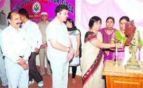 Dr Shamim Sharma, Managing Director of JCD Vidyapeeth, lights a lamp to inaugurate a function to mark World Book Day in Sirsa