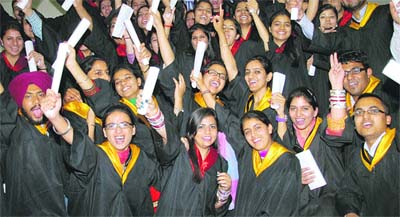 Students of Guru Nanak Dev University College, Ladowali Road, exult after getting their degrees on Thursday. 