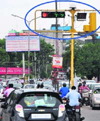 With the traffic lights out of order, motorists have a tough time making their way through heavy traffic at Bharat Nagar Chowk in Ludhiana on Thursday. Tribune photo: Himanshu Mahajan 