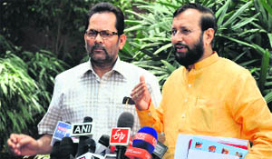 BJP MPs Prakash Javadekar (right) and Mukhtar Abbas Naqvi address mediapersons in New Delhi on Thursday. 