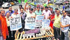 Congress activists take out a mock funeral procession of Saradha group chit fund company chief Sudipta Sen in Kolkata on Thursday. 
