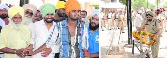 An inconsolable father and two sons of head constable Avtar Singh, who was shot down by three undertrials on Thursday, during the cremation of the cop in Bathinda on Friday; and Inspector General NS Dhillon laying a wreath at the pyre of the martyr. Tribune photos: Pawan sharma